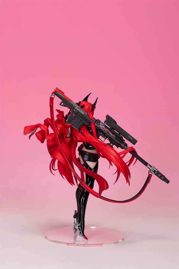 A figure of a character with long red hair and black attire, holding a futuristic firearm, set against a pink background.