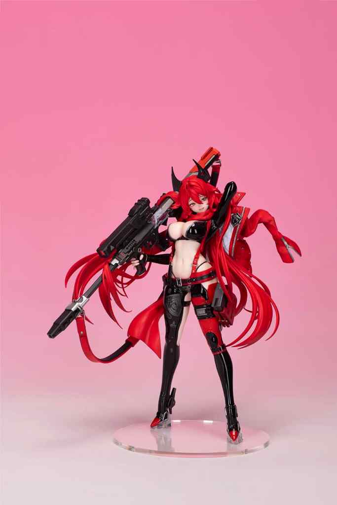 A detailed figure of a character with long red hair, wearing a black and red outfit, holding a large weapon. The figure stands on a clear base against a pink background.