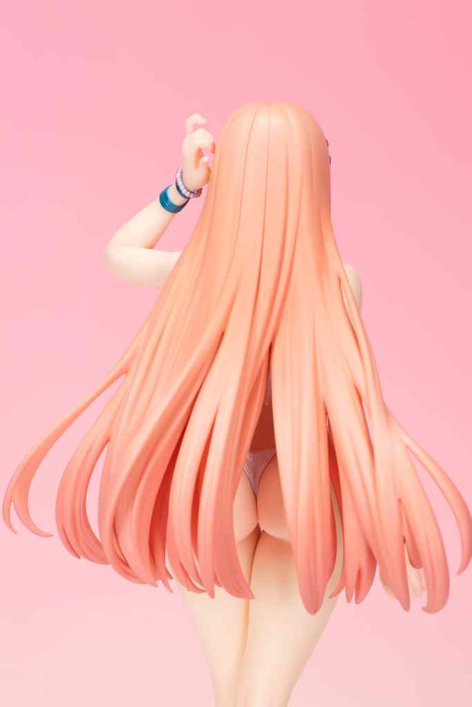 A close-up of a figurine depicting a character with long, flowing pink hair, viewed from the back, with a pink background.