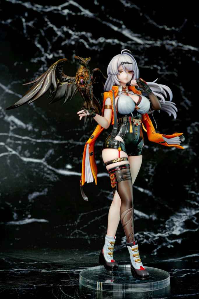 A detailed figure of a female character with long silver hair, wearing an orange and black outfit, striking a confident pose. She has a large winged creature perched on her arm, and intricate accessories including thigh-high stockings and stylish boots.