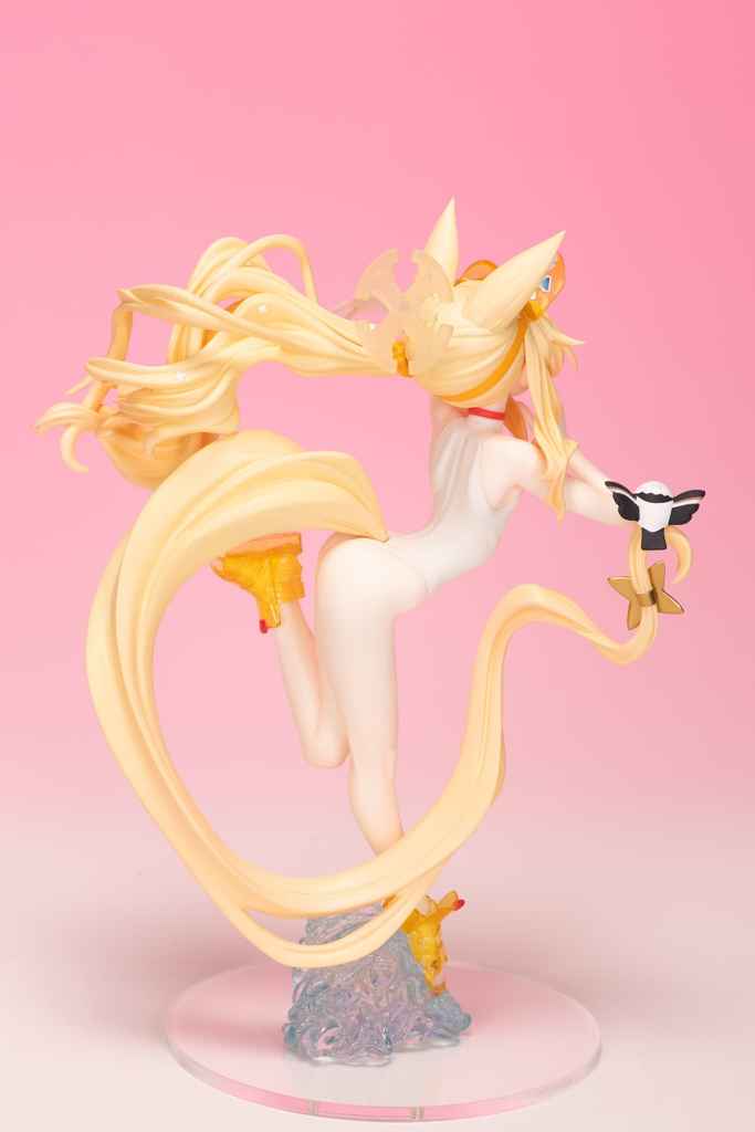 A colorful figurine of a character with long blonde hair and a flowing tail, wearing a white outfit and yellow shoes, holding a small item in one hand, posed against a pink background.